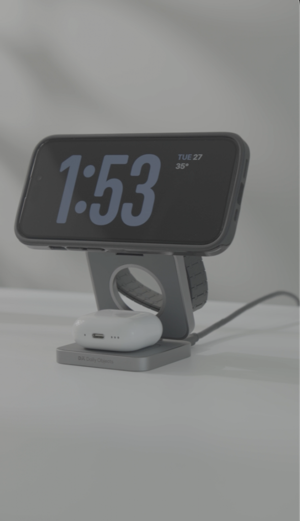 DailyObjects SURGE™ Max Foldaway 3-In-1 Magnetic MagSafe Wireless Charger is charging the three devices—iPhone, Apple Watch and AirPods simultaneously.
