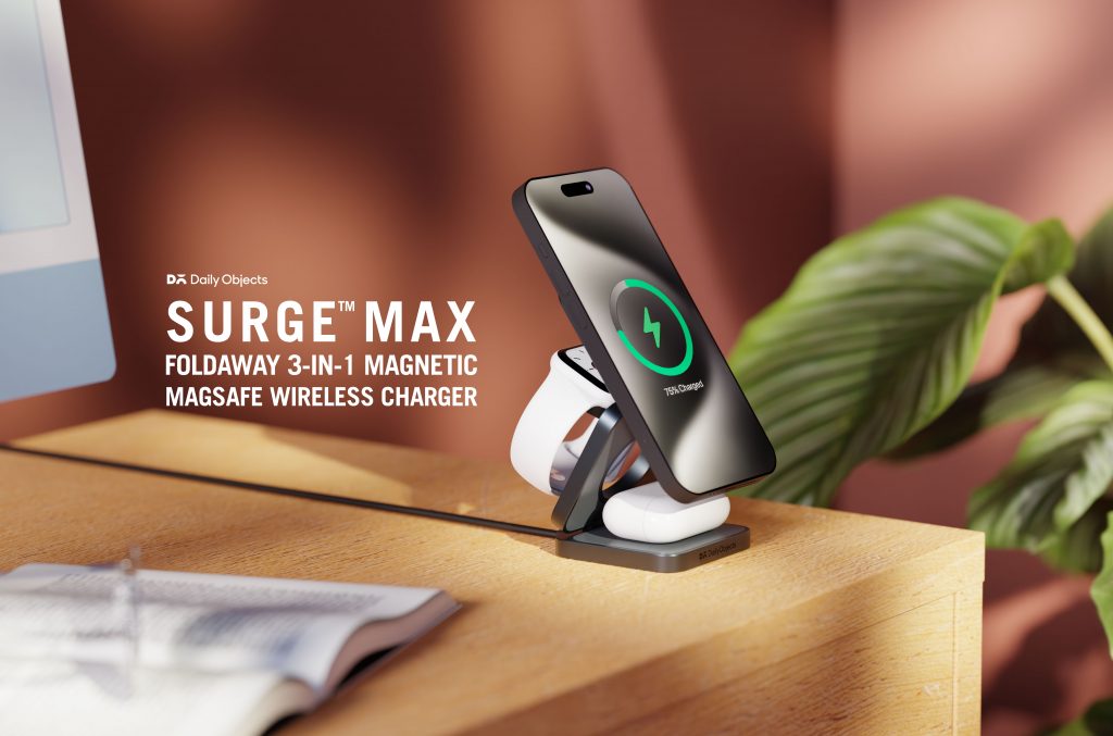 DailyObjects Surge™ Max Foldaway 3-in-1 Magnetic MagSafe Wireless Charger displayed folded out on a desk, charging an iPhone, AirPods, and Apple Watch simultaneously, with a sleek, minimalist design in view.